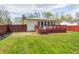 Backyard featuring a wood deck, privacy fence, and plenty of green space at 739 Laurel Ln, Fortville, IN 46040