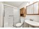 The bathroom features a glass-enclosed shower, a toilet, and a single sink with medicine cabinet at 739 Laurel Ln, Fortville, IN 46040