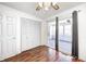 This bedroom has wood flooring, a ceiling fan, closet, and access to an enclosed outdoor living space at 739 Laurel Ln, Fortville, IN 46040