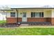 Inviting entryway with decorative door, fresh landscaping, and brick facade details at 739 Laurel Ln, Fortville, IN 46040