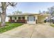 Lovely single-story home featuring a spacious front yard, brick accents, and covered parking area at 739 Laurel Ln, Fortville, IN 46040