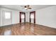 Inviting living room with wood floors and a ceiling fan fixture at 739 Laurel Ln, Fortville, IN 46040