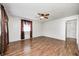 Bright living room with wood-look flooring and a ceiling fan at 739 Laurel Ln, Fortville, IN 46040