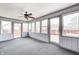 The sunroom features many windows and a fan at 739 Laurel Ln, Fortville, IN 46040