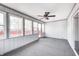 The sunroom features many windows and a fan at 739 Laurel Ln, Fortville, IN 46040