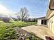 Backyard with a patio and large tree at 7606 Miracle Rd, Indianapolis, IN 46237