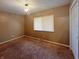 Bedroom with a window and decorative light fixture at 7606 Miracle Rd, Indianapolis, IN 46237