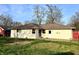 Single-story home features a well-maintained yard and a classic design with a brick exterior and inviting entrance at 7606 Miracle Rd, Indianapolis, IN 46237
