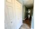 Hallway featuring a closet and hardwood style flooring at 7606 Miracle Rd, Indianapolis, IN 46237