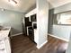 Updated kitchen showcasing stainless steel appliances, granite countertops, and bright white cabinets at 7606 Miracle Rd, Indianapolis, IN 46237