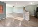 Open-concept living area featuring new floors, fresh paint, and lots of natural light at 7606 Miracle Rd, Indianapolis, IN 46237