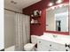 Beautiful bathroom with a modern vanity, and a shower/tub combo with decorative shelves at 8160 Shaldon Ct, Zionsville, IN 46077