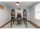 Dedicated home office space features a neutral color palette and natural lighting at 8160 Shaldon Ct, Zionsville, IN 46077