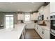Modern kitchen boasting white cabinets, stainless steel appliances, and quartz countertops at 8160 Shaldon Ct, Zionsville, IN 46077