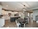 This modern kitchen offers an eat-in area, an island, white cabinetry, and stainless steel appliances at 8160 Shaldon Ct, Zionsville, IN 46077