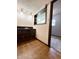 Basement wet bar featuring cabinetry, sink, and tiled backsplash at 8616 Old Dominion Ct, Indianapolis, IN 46231