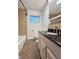 Bathroom featuring a tile shower, and dark countertops at 8616 Old Dominion Ct, Indianapolis, IN 46231