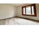 Bright bedroom with a large window offering a picturesque view, and neutral carpeting at 8616 Old Dominion Ct, Indianapolis, IN 46231