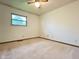 Comfortable bedroom with neutral carpeting, natural lighting, and ample space at 8616 Old Dominion Ct, Indianapolis, IN 46231