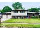 Charming two-story home featuring a well-maintained lawn, attached two-car garage, and welcoming facade at 8616 Old Dominion Ct, Indianapolis, IN 46231