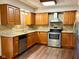 Well-equipped kitchen with granite countertops, stainless steel appliances, and mosaic backsplash at 8616 Old Dominion Ct, Indianapolis, IN 46231