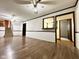 Living room showing new flooring and convenient passthrough to other rooms at 8616 Old Dominion Ct, Indianapolis, IN 46231