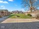 Fenced backyard with well maintained grass, firepit, and plenty of open space at 919 Oak Park Dr, Shelbyville, IN 46176