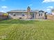 View of the home's backyard, showcasing a lawn and privacy fence at 919 Oak Park Dr, Shelbyville, IN 46176