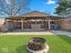 Outdoor cabana with seating area, grill, bar, and covered structure at 919 Oak Park Dr, Shelbyville, IN 46176