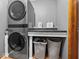 Well-organized laundry room with modern washer and dryer, as well as storage shelves at 919 Oak Park Dr, Shelbyville, IN 46176
