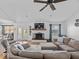Inviting living room with a brick fireplace, hardwood floors, and comfortable seating area at 919 Oak Park Dr, Shelbyville, IN 46176