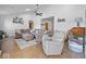 Spacious living room with high ceilings, fan, hardwood floors, and a comfortable seating area at 919 Oak Park Dr, Shelbyville, IN 46176