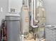 Utility room featuring a newer water heater and HVAC system at 919 Oak Park Dr, Shelbyville, IN 46176