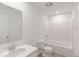 Clean bathroom with white fixtures including a vanity, toilet, and shower-tub combo at 9222 Anthem Ave, Plainfield, IN 46168