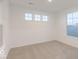 Well-lit bedroom with neutral carpet and three windows at 9222 Anthem Ave, Plainfield, IN 46168