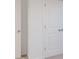 Hallway with white walls, neutral carpet, and doors, showcasing a clean and modern aesthetic at 9222 Anthem Ave, Plainfield, IN 46168