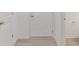 Hallway with door to garage on right side and a second door to a bathroom on the right at 9222 Anthem Ave, Plainfield, IN 46168