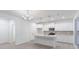 Bright kitchen features stainless steel appliances, a large island, and stylish lighting, making it a chef's dream at 9222 Anthem Ave, Plainfield, IN 46168