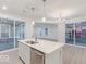 The kitchen has a large island with stainless steel appliances and a dining area, perfect for entertaining at 9222 Anthem Ave, Plainfield, IN 46168