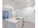 The kitchen features an island with a sink and stainless steel appliances, making meal prep a breeze at 9222 Anthem Ave, Plainfield, IN 46168