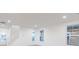 Bright living area with white walls, vinyl floors, and views of the neighborhood at 9222 Anthem Ave, Plainfield, IN 46168
