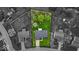 Aerial view highlighting green property featuring home's roof and treed landscape at 9328 Haddington W Dr, Indianapolis, IN 46256