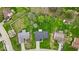Aerial view of the property showing its placement within a tree filled neighborhood at 9328 Haddington W Dr, Indianapolis, IN 46256