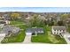 Aerial view of a charming neighborhood featuring well-maintained homes and mature trees at 9328 Haddington W Dr, Indianapolis, IN 46256