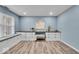 Stylish bedroom featuring custom built-ins, a desk area, and modern flooring at 9328 Haddington W Dr, Indianapolis, IN 46256