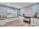 Chic bedroom with built-in storage, desk, window bench, and modern decor at 9328 Haddington W Dr, Indianapolis, IN 46256