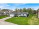 Inviting single-story home with a two-car garage and a beautifully maintained lawn at 9328 Haddington W Dr, Indianapolis, IN 46256