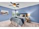 Comfortable main bedroom with a ceiling fan, carpet, and window providing natural light at 9328 Haddington W Dr, Indianapolis, IN 46256