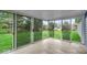 Sunroom features large glass sliding doors with a view to the spacious backyard at 9328 Haddington W Dr, Indianapolis, IN 46256