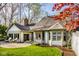 Beautiful backyard features a spacious patio, lush lawn, and mature trees, ideal for outdoor entertaining and relaxation at 9435 Tamarack Dr # 94, Indianapolis, IN 46260